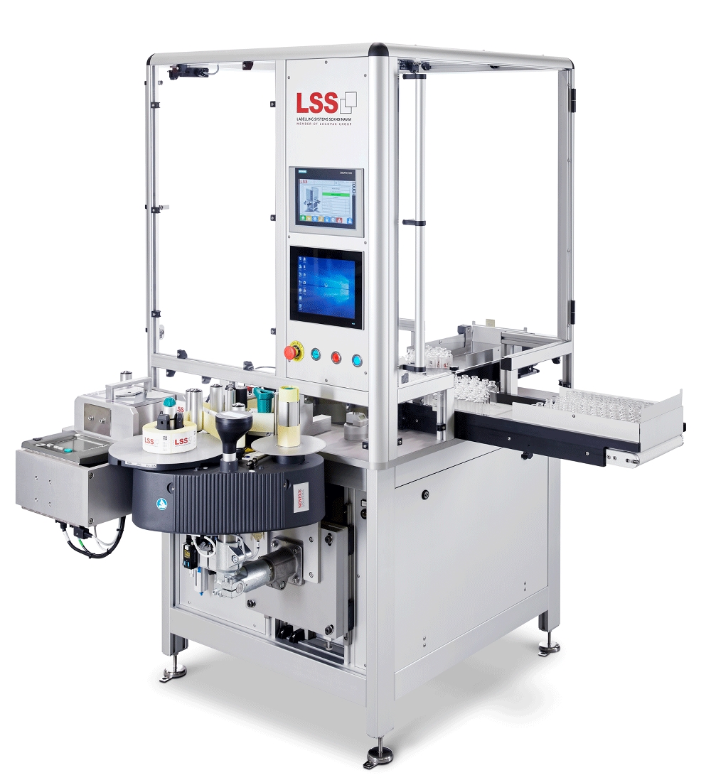 Labeling machine for automatic labelling of vials and ampoules